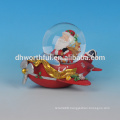 Lovely resin Christmas santa snow globe